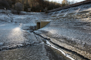 Lago di Barcis - Barcis artificial lake drained of water for routine maintenance, in Friuli-Venezia Giulia, north east Italy. The reservoir was created in 1954 for hydroelectric energy production.