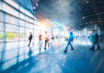 Aufkleber - A blurry image of a modern building in Hong Kong, with people walking through a glass-walled hallway.