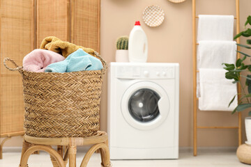 Wall Mural - Wicker basket full of laundry on chair in bathroom