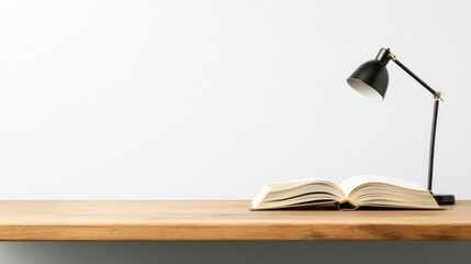 Poster - a minimalist composition featuring an open book on a wooden surface illuminated by a modern desk lam