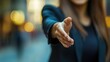 © Alexander Odessa  - Business woman's hand extending her hand for a handshake. Professionally greeting a colleague or a new partner. happy. shallow depth of field