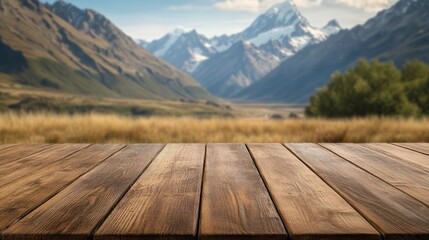 Aufkleber - A wooden table top rests empty, inviting thoughts and reflection, as majestic mountains rise in the distance, surrounded by lush greenery under a vivid sky. Nature's beauty captivates