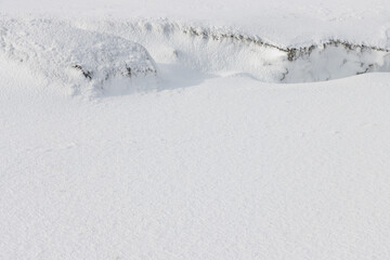 Wall Mural - edge of snow drift on white winter beach