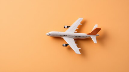 Poster - Toy airplane on orange background with vibrant colors and detailed features of the toy aircraft