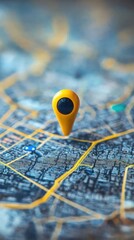 Poster - Close-up of a yellow location pin placed on a detailed city map, highlighting urban navigation and exploration with blurred background