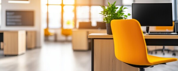 Poster - a modern office space featuring an orange chair, a computer, and natural light streaming through lar