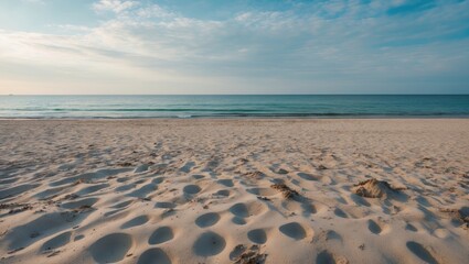 Poster - Tranquil Sandy Beach with Gentle Waves and Open Space for Text or Product Promotion