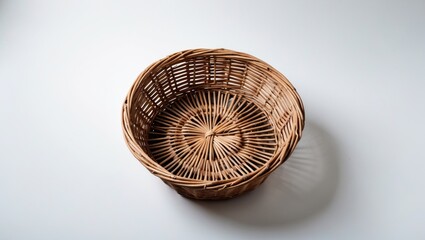 Poster - Woven Rattan Basket Isolated on White Background Ideal for Storage or Decoration in Home and Garden Settings