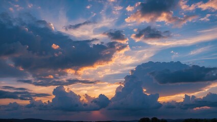 Wall Mural - dramatic evening sky with vibrant clouds and sunset hues over scenic landscape