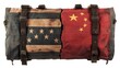 © Nurul - Broken American and Chinese flags on a weathered military bag.