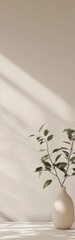 Poster - Elegant simplicity captured in a single leafy plant in a neutral vase on a minimalistic table with soft light