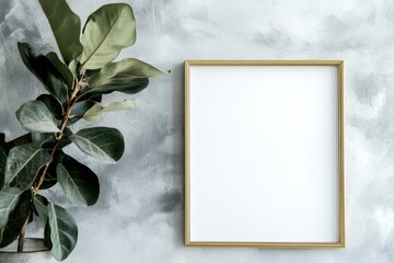Poster - Vertical gold-edged picture frame showcasing a blank canvas against a minimalistic gray backdrop with leafy greenery