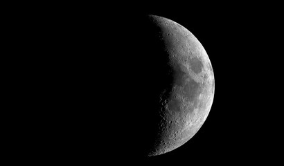 Wall Mural - Beautiful moon in one of its phases on a black background