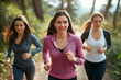 © Road Red Runner - Three women enjoy a nature walk while jogging, embracing wellness and mindfulness in a serene outdoor setting