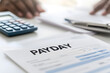© A2Z AI  - Financial document with 'PAYDAY' written on it, calculator, pen, and human hand visible, suggesting financial planning or expense calculation.