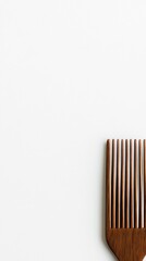 Fototapete - Close up view of a wooden comb with strands of hair on a white surface allowing space for creative text. Generative AI