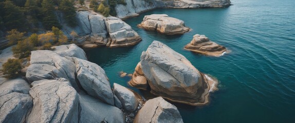 Poster - Aerial View of Unique Rock Formations in Serene Blue Waters with Copy Space for Text. Perfect for Nature and Travel Themes.