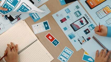 Poster - top view panorama video of startup company employee planning on user interface prototype for mobile 