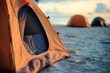 © Alena - Two tents set up on a sandy beach, perfect for camping or outdoor events