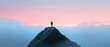 © Mandeep - silhouette of a person on a mountain peak at sunset