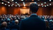 © Azmanrazak - Rear View of Professional Businessman at Business Event, Focusing on Strategy, Investment, Growth, and Wealth