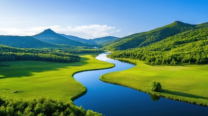 Wall Mural - A vibrant river winds through a lush green valley landscape