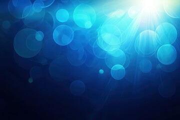 Wall Mural - shimmering blue bokeh with light rays and soft background effects