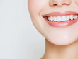 © Sophie - young east asian girl woman model gen z gen alpha clear skin blush smiling against a white background in a studio with clear glass skin dental natural dentist veneers high definition lip balm tint