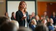 © Prompt2image - A woman stands in front of a captivated audience at a town hall meeting. She communicates with passion and conviction, encouraging community engagement and collaboration on important issues