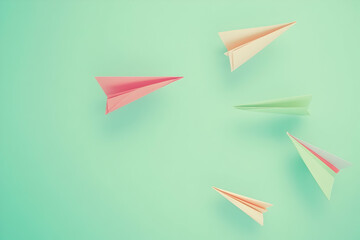 Poster - Colorful paper airplanes flying in the same direction on a turquoise background