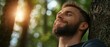 © anatolii - Man enjoys peaceful moment in forest, experiencing nature and tranquility during golden hour