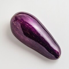 Poster - Vibrant purple eggplant displaying glossy skin with rich color tones and smooth texture from a garden harvest