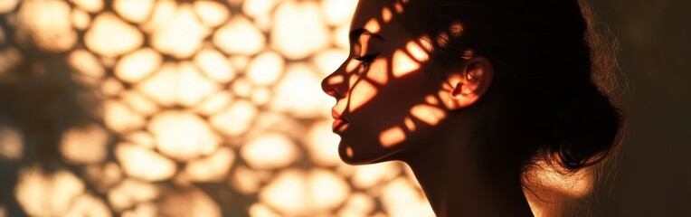 Poster - Serene portrait of a woman captured in soft light with intricate shadows highlighting her features