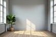© supansa - Sunlight streams into a minimalist room, illuminating a plant in a woven basket, hardwood floors, and a blank wall perfect for design inspiration.