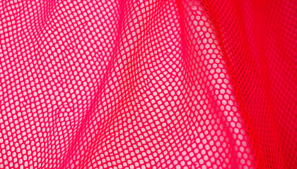 Close-up of pink mesh fabric with intricate texture and geometric patterns, creating a stylish and modern textile background.