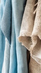 Fototapete - Textures of nature in soothing blue and beige fabrics hanging gracefully in a bright, airy space