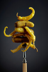 Canvas Print - Canned yellow peppers and cucumbers on a black background.