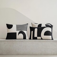 Wall Mural - Minimalist black-and-white pillows with bold graphic designs, styled on a concrete bench