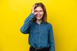 © luismolinero - Young English woman isolated on yellow background showing ok sign with fingers