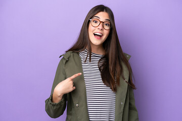 Wall Mural - Young Brazilian woman isolated on purple background with surprise facial expression