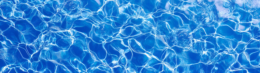 Poster - Enchanting blue water texture with dynamic ripple patterns shimmering reflections and a serene calming atmosphere  This image evokes a sense of tranquility freshness and natural beauty
