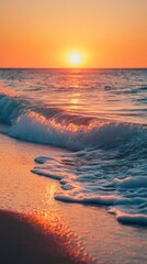 Wall Mural - Soft ocean waves washing ashore at sunset on sandy beach