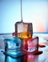 Aufkleber - Melting Ice Cubes With Vibrant Pigments Create a Colorful Winter Wonderland During Sunset