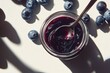 © Andrii  - Sweet Blueberry Jam with Fresh Berries on White
