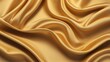 © MdOzal - Gold Silk background. Golden Luxury background. Wave and Light effect. Design element. Abstract background texture pattern. Texture backdrop.