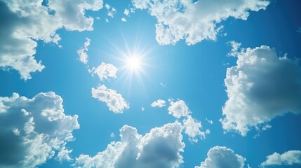 Wall Mural - A bright beam of sunlight breaks through the cloudy sky, illuminating a small area