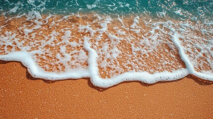 Poster - The foamy texture of water captured on a beach with gentle waves lapping the shore