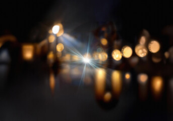 Poster - Blurry image of a dark room with glowing lights reflecting on a smooth surface.