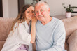 © Tatyana Gladskih - Older mature father and grown millennial daughter laughing embracing, caring smiling young woman embracing happy senior middle aged dad