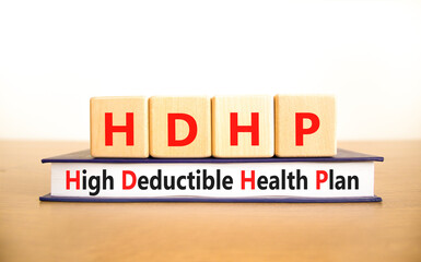 HDHP High Deductible Health Plan symbol. Concept word HDHP High Deductible Health Plan on beautiful blocks. Beautiful white background. Business HDHP High Deductible Health Plan concept. Copy space.